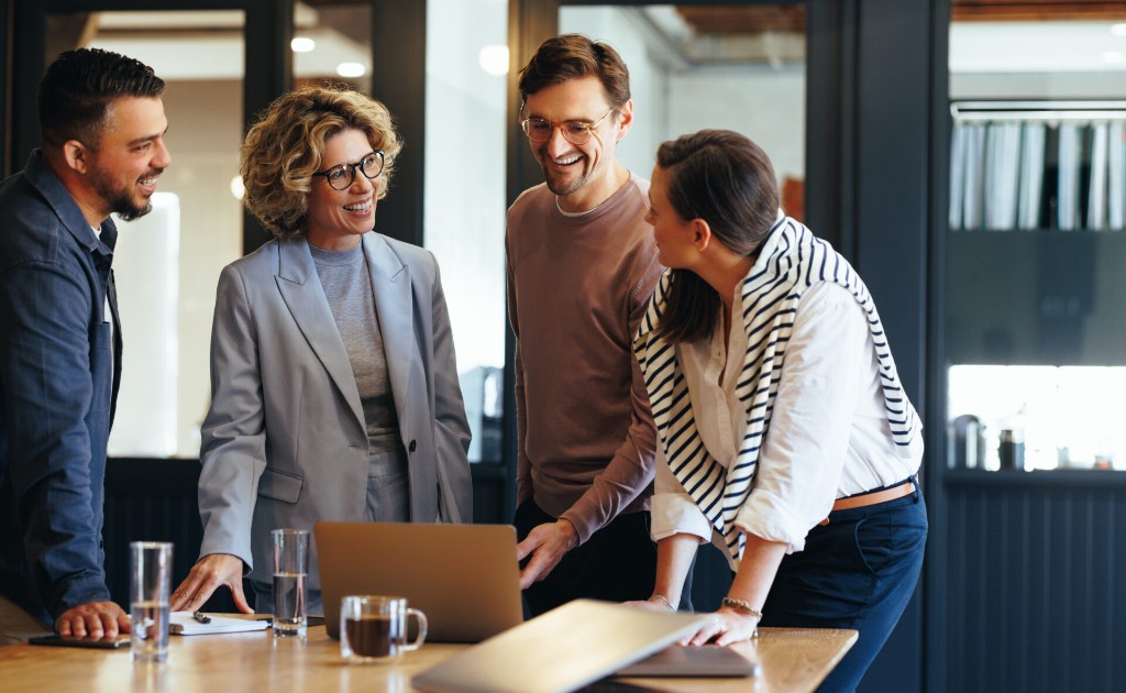 Professional team collaborating in a modern office around a conference table