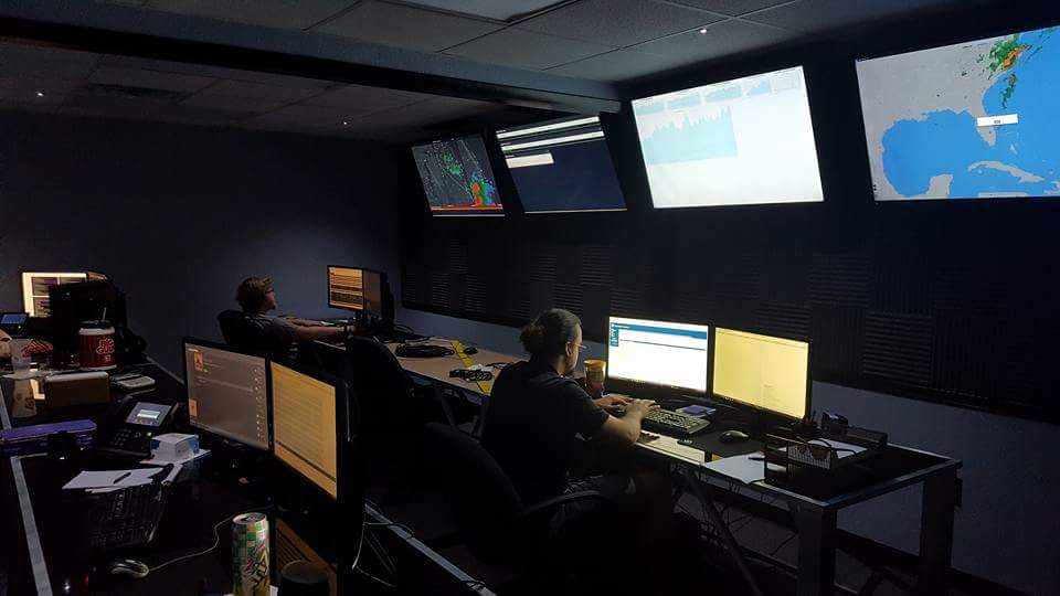 Security operations center with analysts monitoring displays